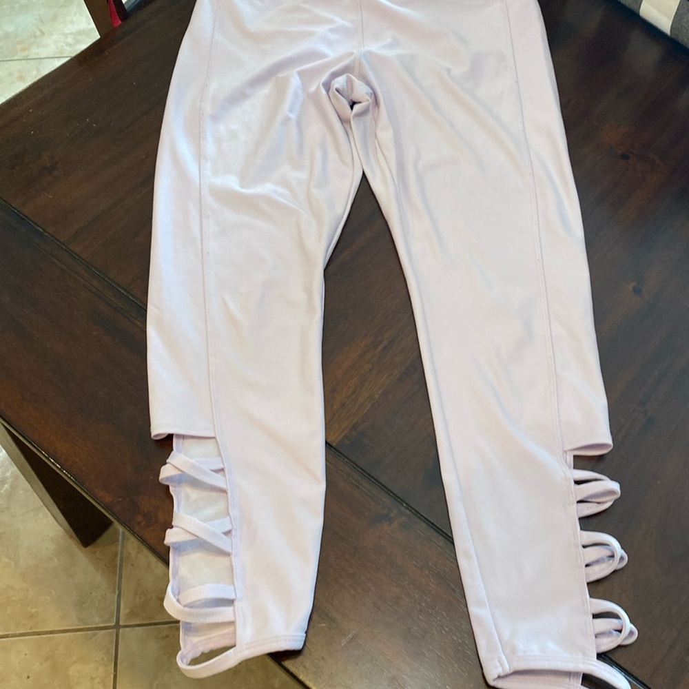 Light lavender colored leggings cross cross detail on leg